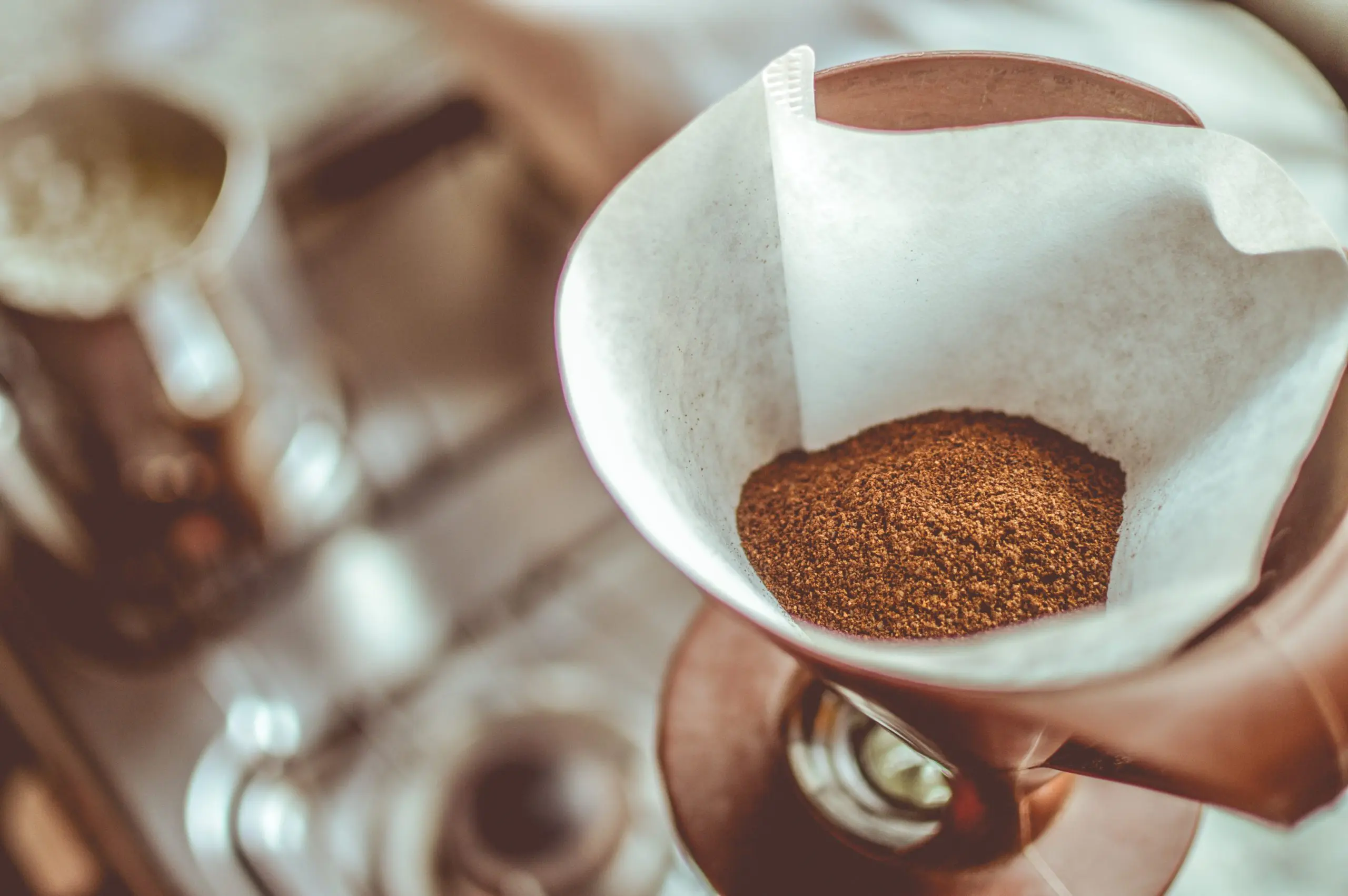 Is it safe to dispose of coffee grounds down the sink?